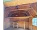 The shed interior features exposed wood, shelving, and a window at 728 Slew Ave, Lawrenceville, GA 30043