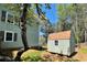 Exterior view of shed with neutral siding and a contrasting roof at 728 Slew Ave, Lawrenceville, GA 30043