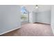 Spacious bedroom with large arch window and neutral carpet providing lots of natural light at 130 Arbor Cove Way, Stockbridge, GA 30281