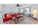 Comfortable living room with natural light, neutral carpet, and ceiling fan at 130 Arbor Cove Way, Stockbridge, GA 30281