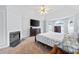 Large main bedroom with a fireplace, sitting area, vaulted ceiling, carpeted floors, and a ceiling fan at 130 Arbor Cove Way, Stockbridge, GA 30281