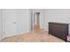 Neutral bedroom featuring a door, an additional doorway, and a dresser at 3986 Harmony Walk Se Way, Smyrna, GA 30082