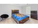 Bedroom featuring carpet floors, a window, and a dark wood bed frame at 3986 Harmony Walk Se Way, Smyrna, GA 30082
