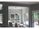 Bright dining area with a modern glass table, white chairs, and abundant natural light at 3986 Harmony Walk Se Way, Smyrna, GA 30082