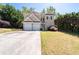 Two-story home with two-car garage, front yard with a mature tree at 3986 Harmony Walk Se Way, Smyrna, GA 30082