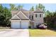 Charming two-story home featuring a two-car garage and well-manicured lawn at 3986 Harmony Walk Se Way, Smyrna, GA 30082
