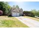 Charming home with a well-manicured lawn and two-car garage at 3986 Harmony Walk Se Way, Smyrna, GA 30082