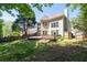 Backyard view of a well-maintained house with a multi-level deck and manicured lawn at 3986 Harmony Walk Se Way, Smyrna, GA 30082