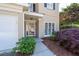 Home exterior featuring landscaped garden and covered entryway at 3986 Harmony Walk Se Way, Smyrna, GA 30082