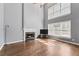 Bright living room features a fireplace, hardwood floors, and large windows at 3986 Harmony Walk Se Way, Smyrna, GA 30082