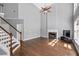 Spacious living room with fireplace, stairs and hardwood floors at 3986 Harmony Walk Se Way, Smyrna, GA 30082