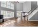Open living room with high ceilings, hardwood floors, and large windows at 3986 Harmony Walk Se Way, Smyrna, GA 30082