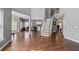 Open floor plan showcases hardwood floors and a staircase with white risers at 3986 Harmony Walk Se Way, Smyrna, GA 30082
