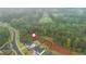 Aerial view of a property surrounded by lush greenery and trees in a serene neighborhood at 1011 Ridgeview Rd, Woodstock, GA 30188