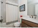 Bathroom features modern fixtures, a bathtub with a shower, and a minimalist design, blending style with functionality at 1011 Ridgeview Rd, Woodstock, GA 30188