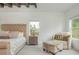 Cozy bedroom with a plush bed, soft lighting, and a comfortable chair, creating a relaxing retreat at 1011 Ridgeview Rd, Woodstock, GA 30188