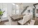 Bright dining room with hardwood floors and neutral furniture, illuminated by a modern light fixture at 1011 Ridgeview Rd, Woodstock, GA 30188