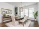 Dining room featuring hardwood floors, modern lighting, and a large window with natural light at 1011 Ridgeview Rd, Woodstock, GA 30188