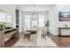 Dining room with hardwood floors, modern light fixture and large table at 1011 Ridgeview Rd, Woodstock, GA 30188