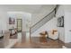 Bright foyer with hardwood floors, staircase, and neutral decor creates a welcoming entrance at 1011 Ridgeview Rd, Woodstock, GA 30188
