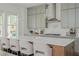Modern kitchen with grey cabinetry, stainless steel appliances, and a quartz countertop island at 1011 Ridgeview Rd, Woodstock, GA 30188