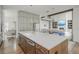 Open concept kitchen featuring a large island with seating, stainless steel appliances, and modern finishes at 1011 Ridgeview Rd, Woodstock, GA 30188