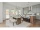 Eat-in kitchen features custom cabinets, a center island with seating, and stainless steel appliances at 1011 Ridgeview Rd, Woodstock, GA 30188