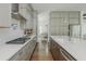Modern kitchen with stainless steel appliances, quartz countertops, and gray cabinets at 1011 Ridgeview Rd, Woodstock, GA 30188