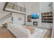 Two story living room with staircase, hardwood floors, custom built-ins, fireplace, and open concept design at 1011 Ridgeview Rd, Woodstock, GA 30188