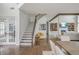 Bright and open living space with hardwood floors, staircase, and seamless transition to the dining area at 1011 Ridgeview Rd, Woodstock, GA 30188