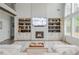 Cozy living room features a fireplace, custom built-ins, a large sectional sofa, and hardwood floors at 1011 Ridgeview Rd, Woodstock, GA 30188
