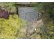Aerial view of a home with a well-maintained roof and backyard area surrounded by mature trees at 1245 Briar Hills Ne Dr, Atlanta, GA 30306