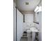 Modest bathroom with a pedestal sink and tiled walls at 1245 Briar Hills Ne Dr, Atlanta, GA 30306