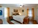 Sunny bedroom with hardwood floors, a ceiling fan, and closet at 1245 Briar Hills Ne Dr, Atlanta, GA 30306