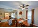 Open-concept dining area with hardwood floors, wooden furniture, and a view into the living room at 1245 Briar Hills Ne Dr, Atlanta, GA 30306