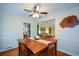 Dining room featuring a wooden table, chairs, hardwood floors, and easy access to other living areas at 1245 Briar Hills Ne Dr, Atlanta, GA 30306