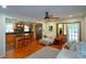 Open-concept living room features hardwood floors, access to the kitchen, and an exterior door at 1245 Briar Hills Ne Dr, Atlanta, GA 30306