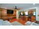 Open-concept living room with a wood accent wall connects to the kitchen at 1245 Briar Hills Ne Dr, Atlanta, GA 30306