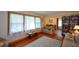 Bright living room featuring hardwood floors, large windows, and a view into the dining room at 1245 Briar Hills Ne Dr, Atlanta, GA 30306