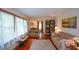 Bright living room with hardwood floors, large windows, and cozy furnishings, perfect for relaxation at 1245 Briar Hills Ne Dr, Atlanta, GA 30306
