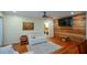 Bright living room features hardwood floors, ceiling fan, and a wood accent wall at 1245 Briar Hills Ne Dr, Atlanta, GA 30306