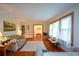 Sun-filled living room featuring hardwood floors, ample seating, and a view into other rooms at 1245 Briar Hills Ne Dr, Atlanta, GA 30306