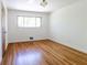 Bright bedroom featuring wood floors, natural light, and a neutral color scheme at 558 Larchmont Nw Dr, Atlanta, GA 30318