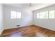 Empty bedroom featuring hardwood floors, large windows, and natural light at 558 Larchmont Nw Dr, Atlanta, GA 30318