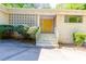 Close-up of the entrance, which features a decorative facade and eye-catching yellow double doors at 558 Larchmont Nw Dr, Atlanta, GA 30318