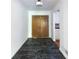 The home's foyer features dark-tiled floors, neutral paint, and a light fixture at 558 Larchmont Nw Dr, Atlanta, GA 30318
