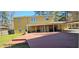 A large red wood deck sits at the back of the house, accessible via double doors at 1406 High Sierra Dr, Lawrenceville, GA 30043
