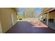 Wide shot of a red wood deck, back door and large lawn in the backyard at 1406 High Sierra Dr, Lawrenceville, GA 30043