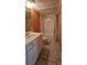 Bathroom with a large mirror, a white vanity with sink and a shower/tub combo at 1406 High Sierra Dr, Lawrenceville, GA 30043