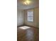 Charming bedroom with wood-look flooring and a closet at 1406 High Sierra Dr, Lawrenceville, GA 30043